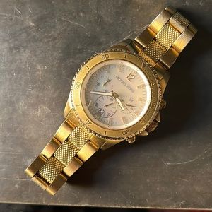 Yellow Gold MK watch with “diamonds” and mother of pearl face